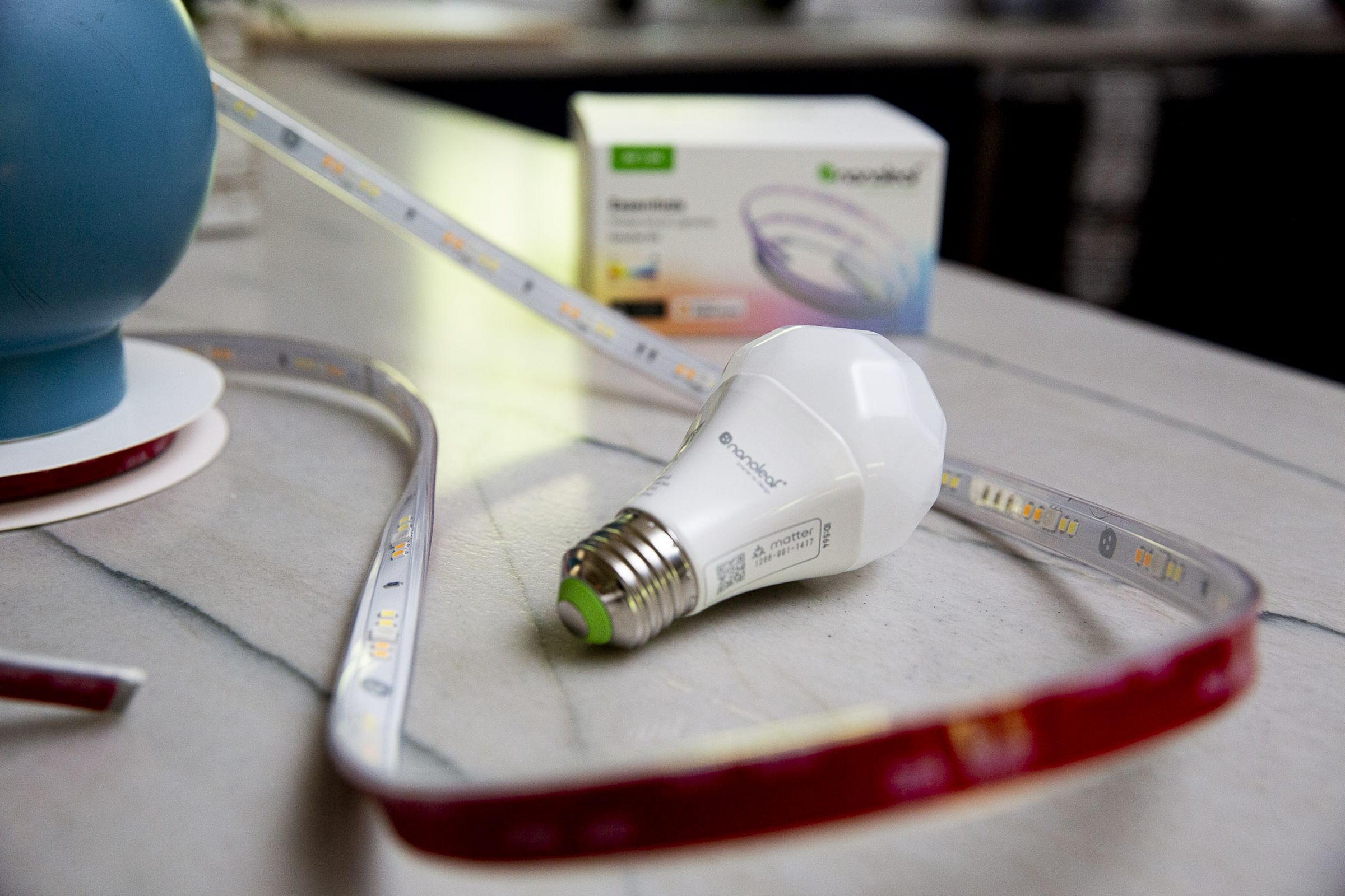 Nanoleaf Matter bulb and light strip on a table